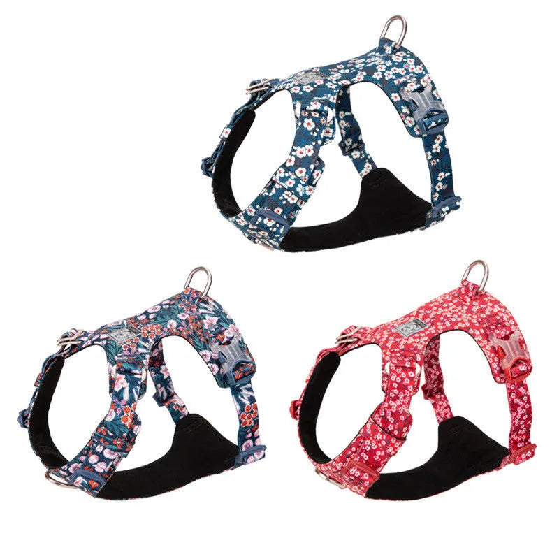 Floral pattern pure cotton dog harness vest shown in blue, green, and red colours on a size chart from XXS to XL.