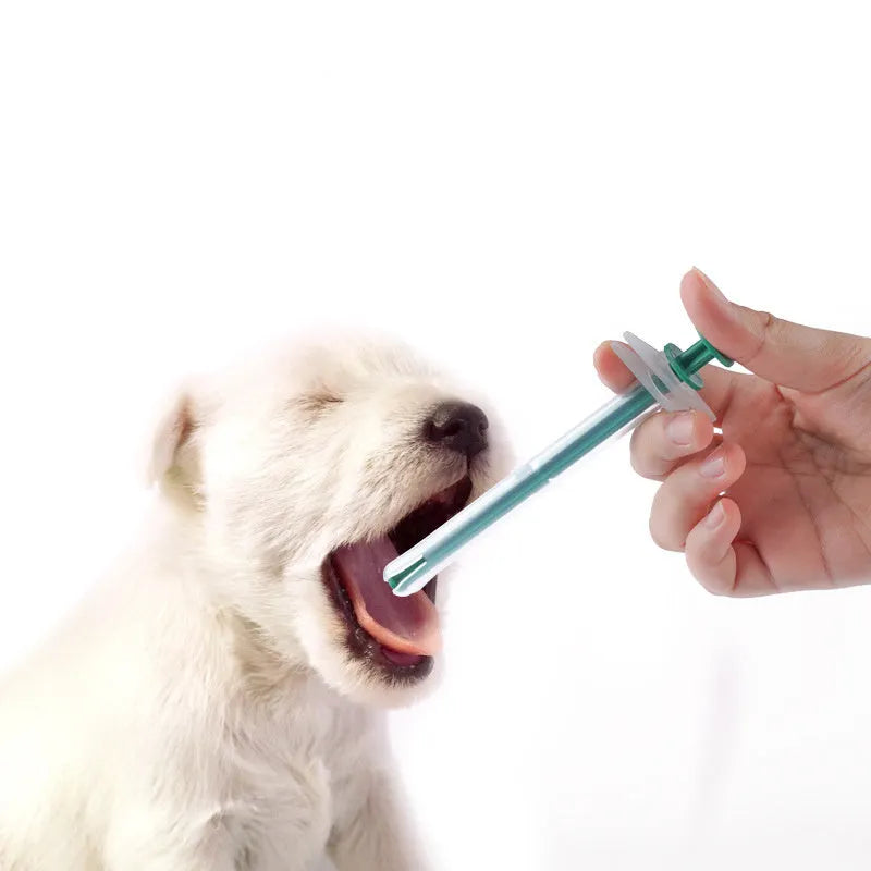 Two silicone pet pill shooter tools with soft tips for administering medication to cats and dogs.