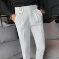 Straight-leg solid colour casual trousers in polyester on a size chart showing waist sizes 29 to 36.