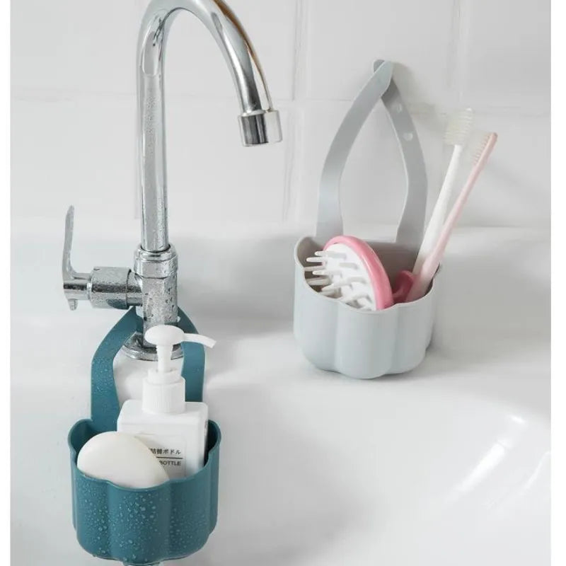 Plastic sink drain basket in Nordic style, shown in dark blue, measuring 20 cm long by 10 cm wide.