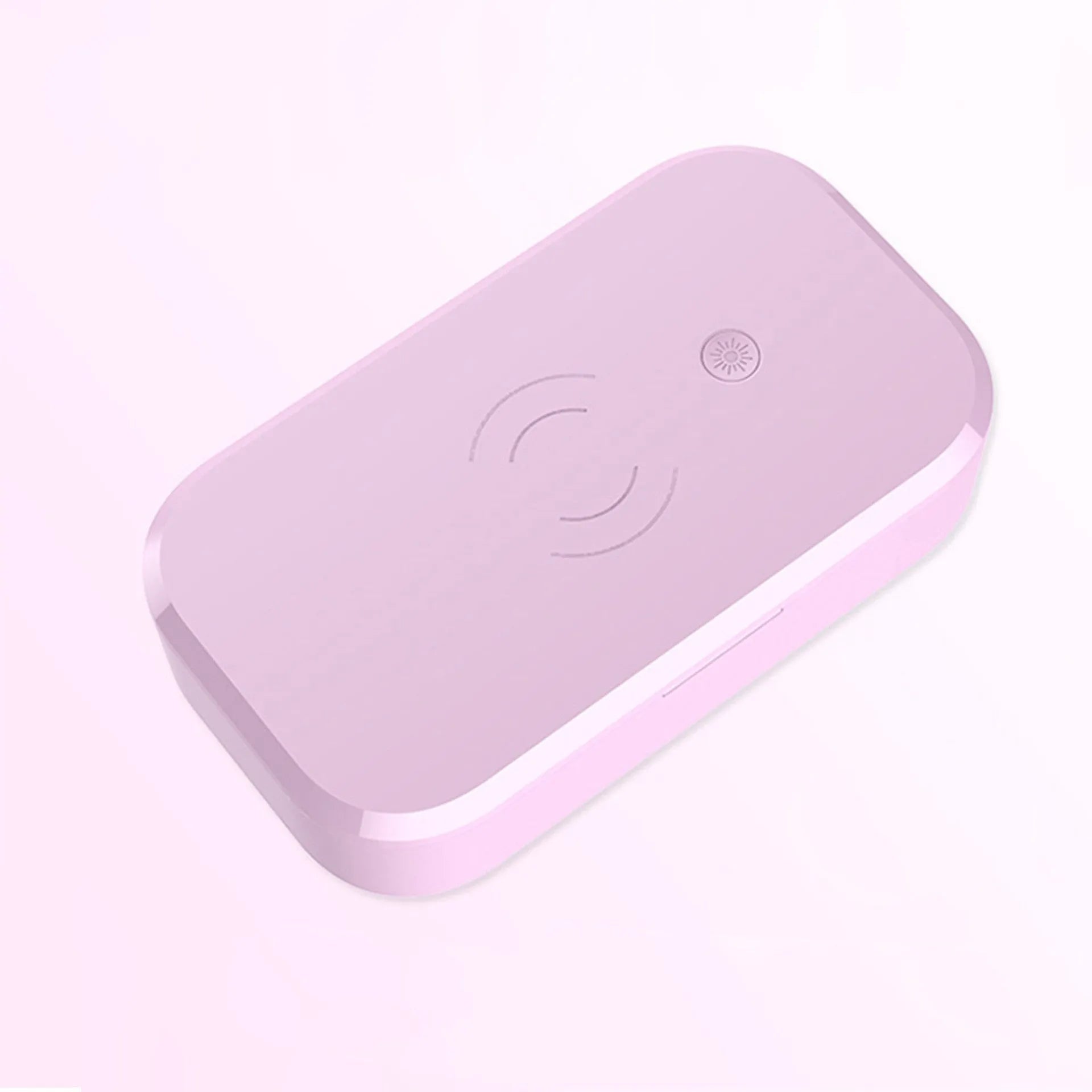 White ultraviolet disinfection box with wireless charging pad inside for phones and beauty tools.
