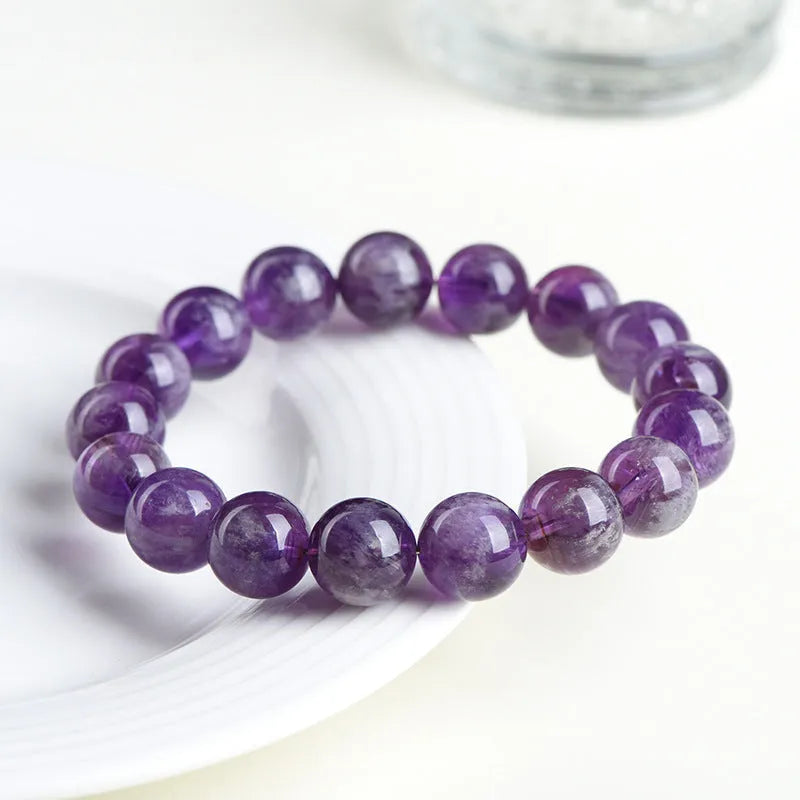 Natural feather amethyst snow mountain purple bracelet with geometric beads featuring the Ruyi symbol.