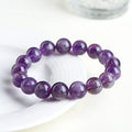 Natural feather amethyst snow mountain purple bracelet with geometric beads featuring the Ruyi symbol.