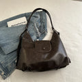 Women's PU leather commuter shoulder bag in horizontal square shape with single strap and optional pendant