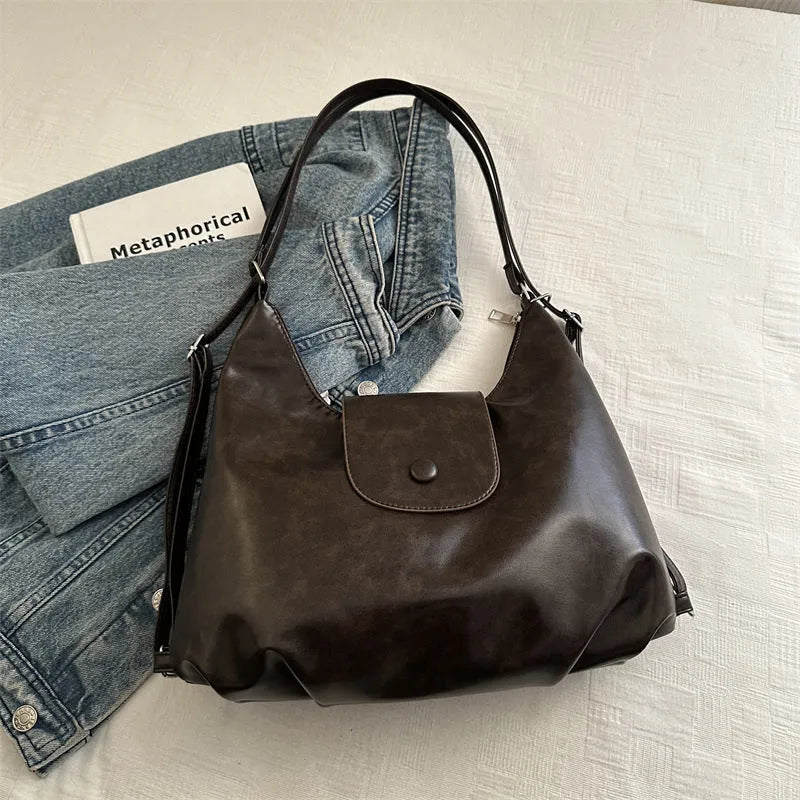 Women's PU leather commuter shoulder bag in horizontal square shape with single strap and optional pendant