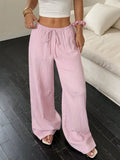 Women's black wide-leg trousers with lace-up waist detail on mid-waist