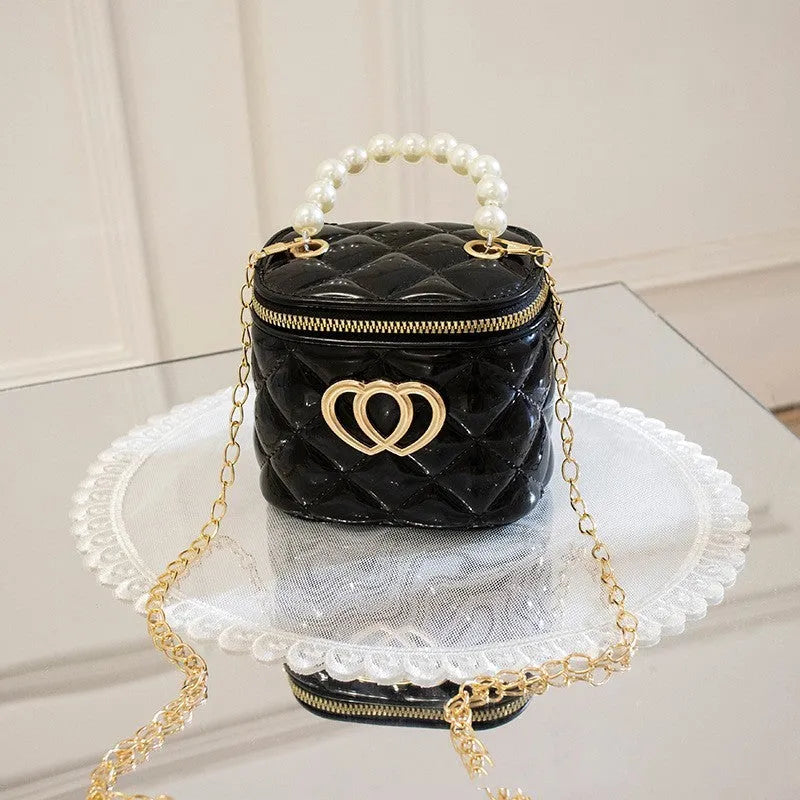 White PVC bucket-shaped gel bag with a heart pattern visible inside the open top.
