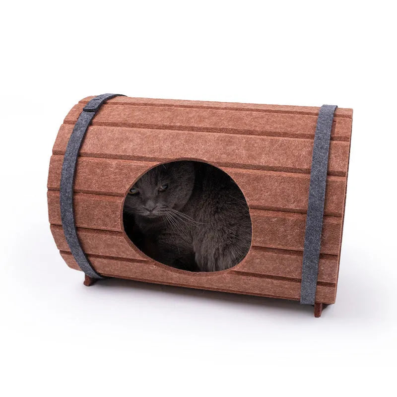 DIY wine barrel shaped cat bed made from three brown felt panels with binding straps