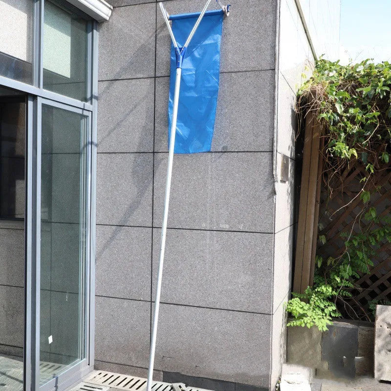 Blue roof snow removal rake with retractable aluminum pole and Oxford cloth on a snow-covered roof