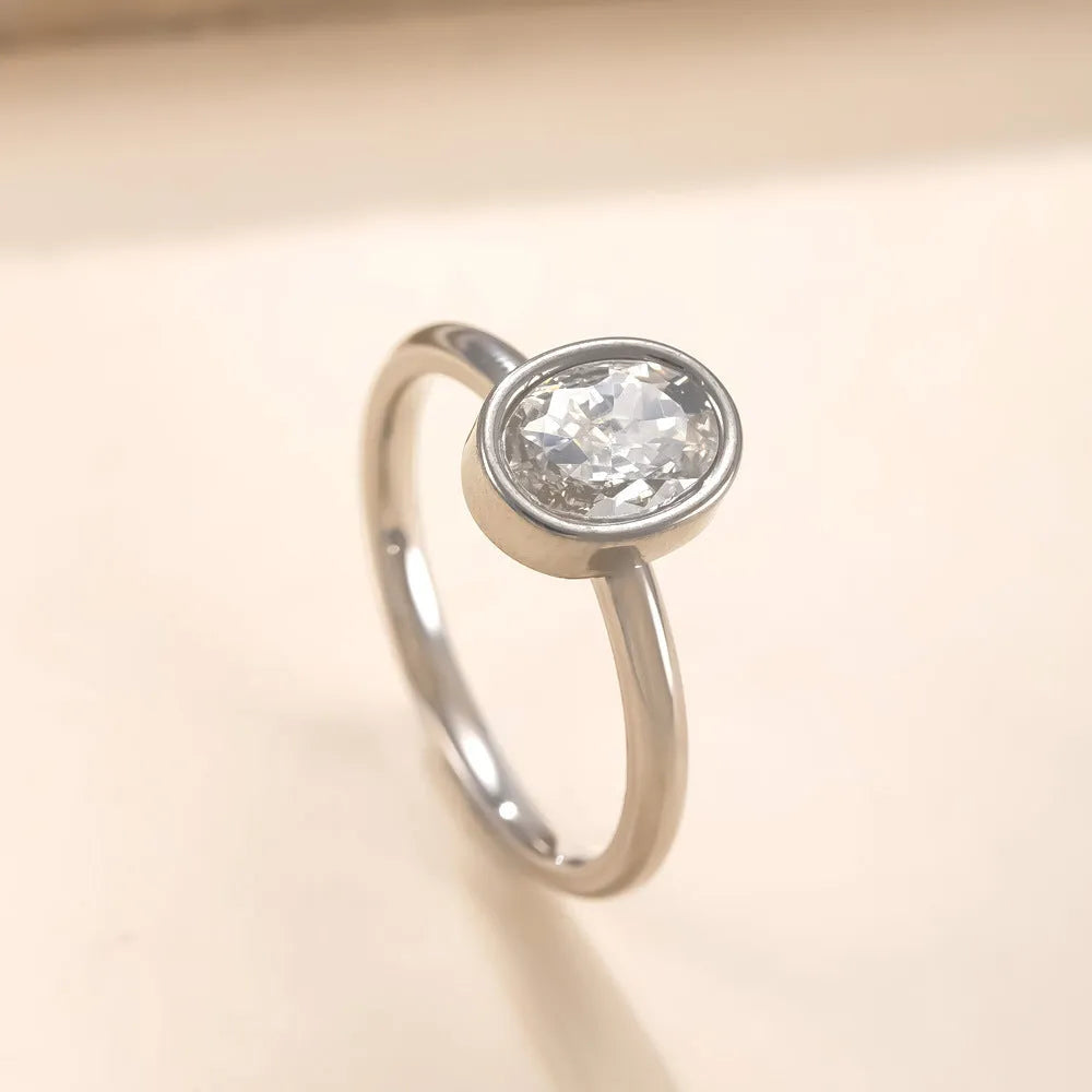 Stainless steel ring with oval zircon stone in geometric shape, unisex, available in steel and gold colours