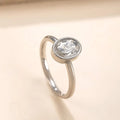 Stainless steel ring with oval zircon stone in geometric shape, unisex, available in steel and gold colours