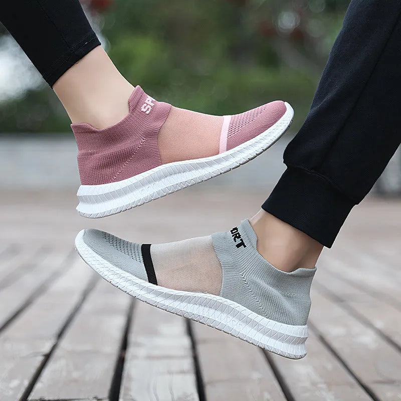 Breathable Flyknit low-top sock shoes in khaki colour with lace and tassel details.