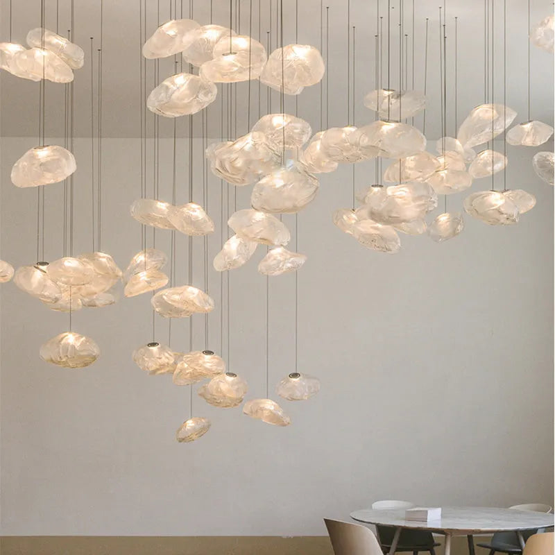 Modern fabric chandelier with glass shade shown in small and large sizes with clear, amber, and smoke grey light options.