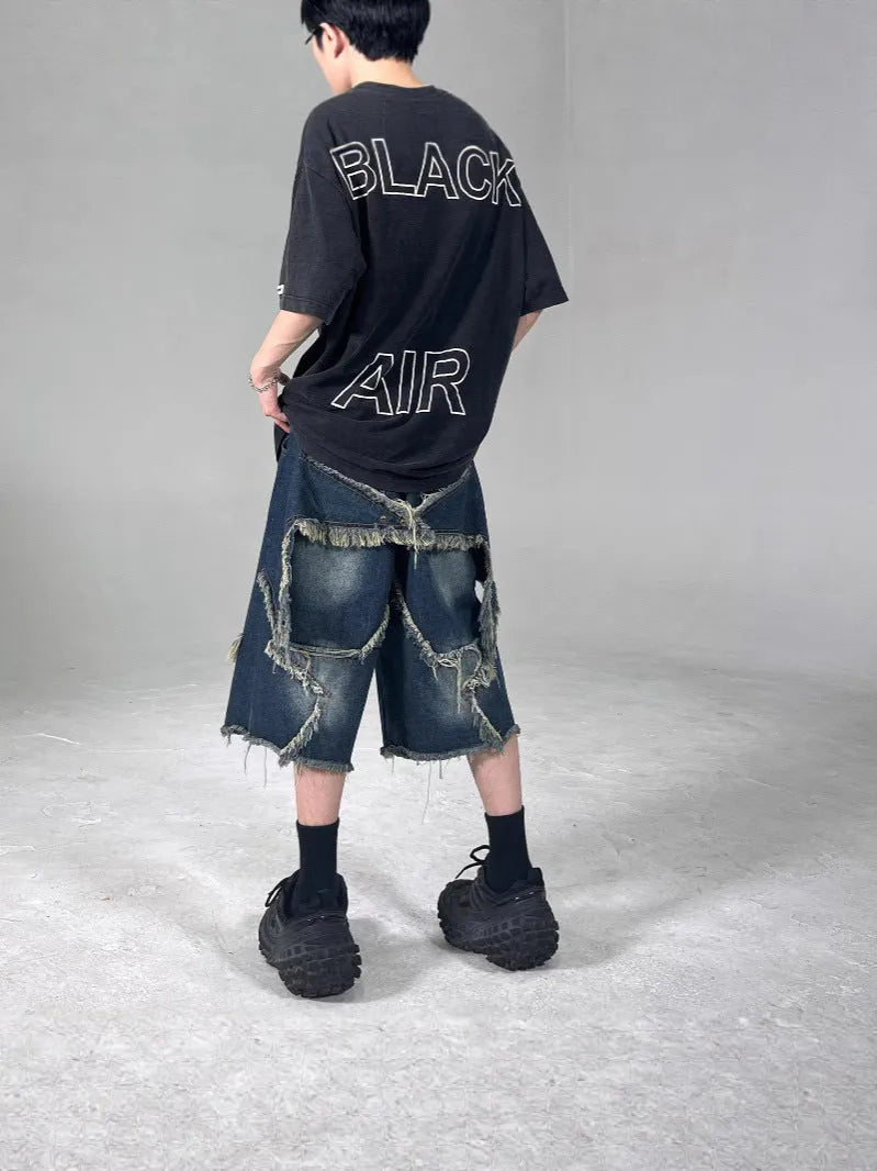 Blue men's loose fit denim shorts with frayed hem and embroidered five-pointed star retro design