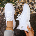Women's low-top mesh sneakers in various colours with a platform sole and front lace-up design.