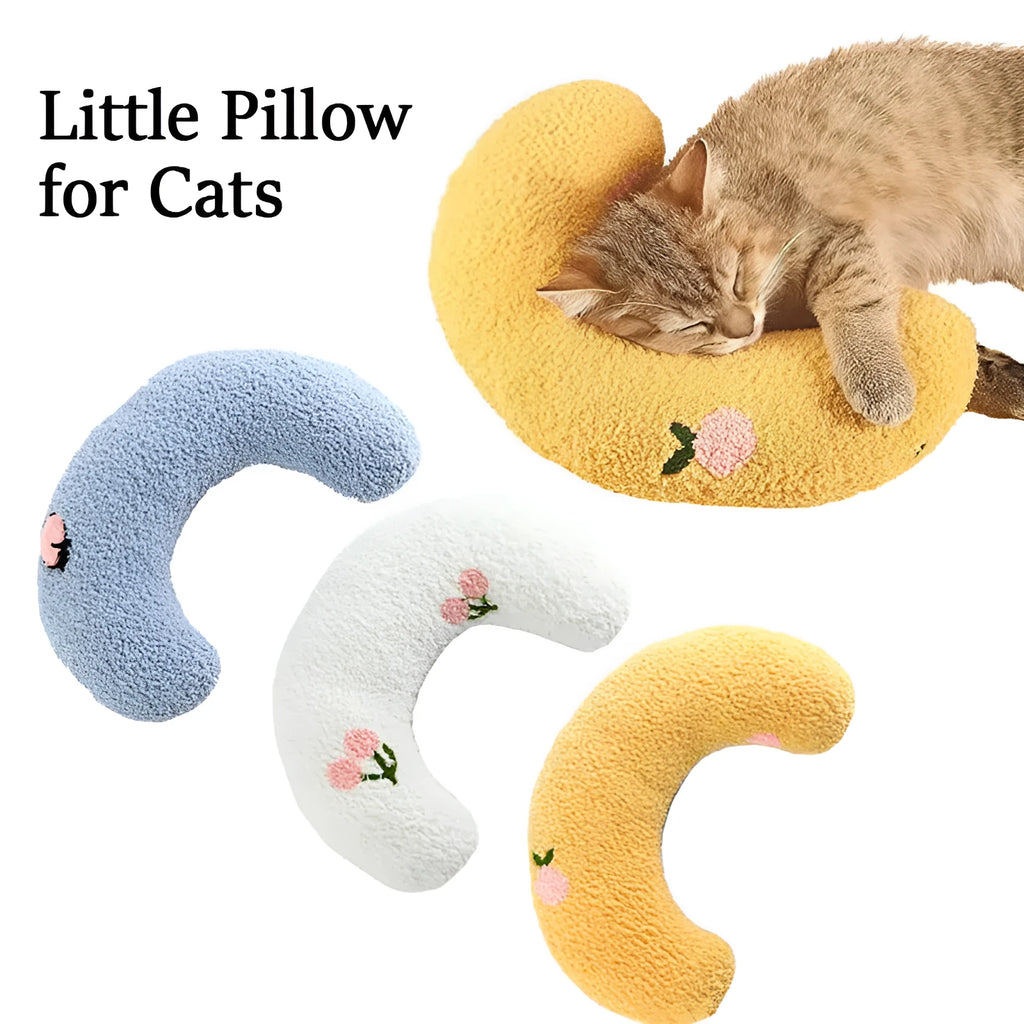 Small white half-donut shaped pet pillow with quilted faux fur for a cat or small dog.