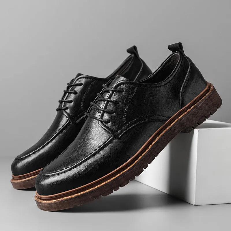 Casual leather shoes in black with round toe, low top design, and visible sewing line detailing