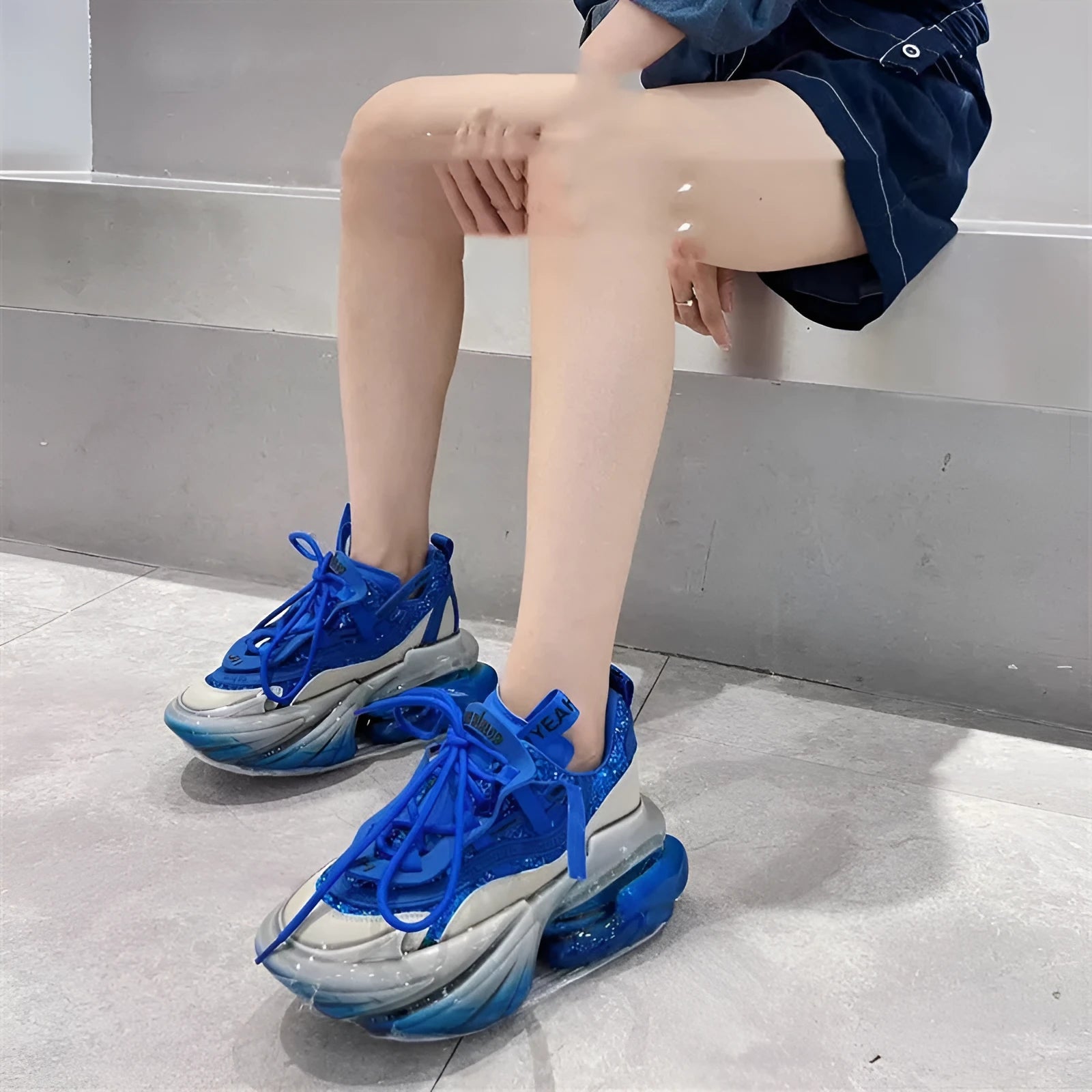 Women's green leather sports shoes with thick soles and cross-tie lacing on a white background.
