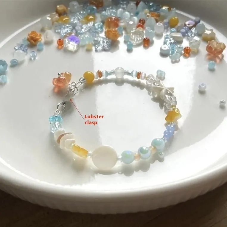 Orange mixed material women's bracelet with diamond shape and round seaside elements