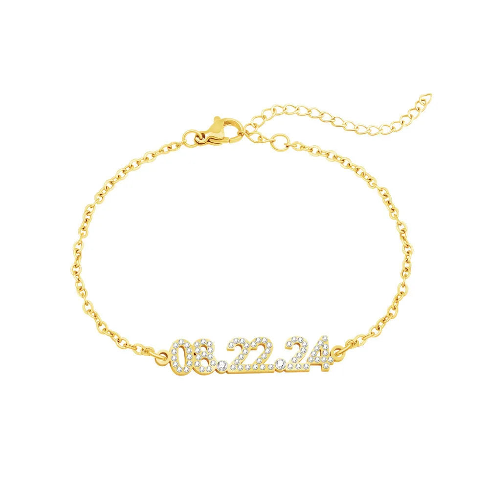 Stainless steel digital bracelet with diamond studded numbers in gold finish.