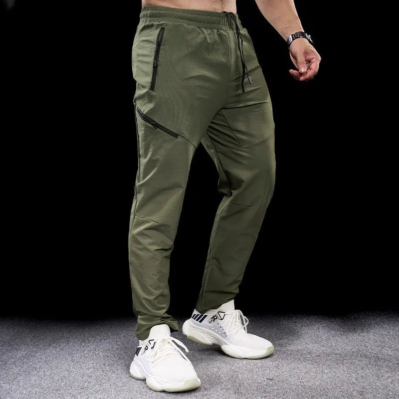 Men's waterproof quick-drying nylon workout trousers in Army Green colour showing mid waist design