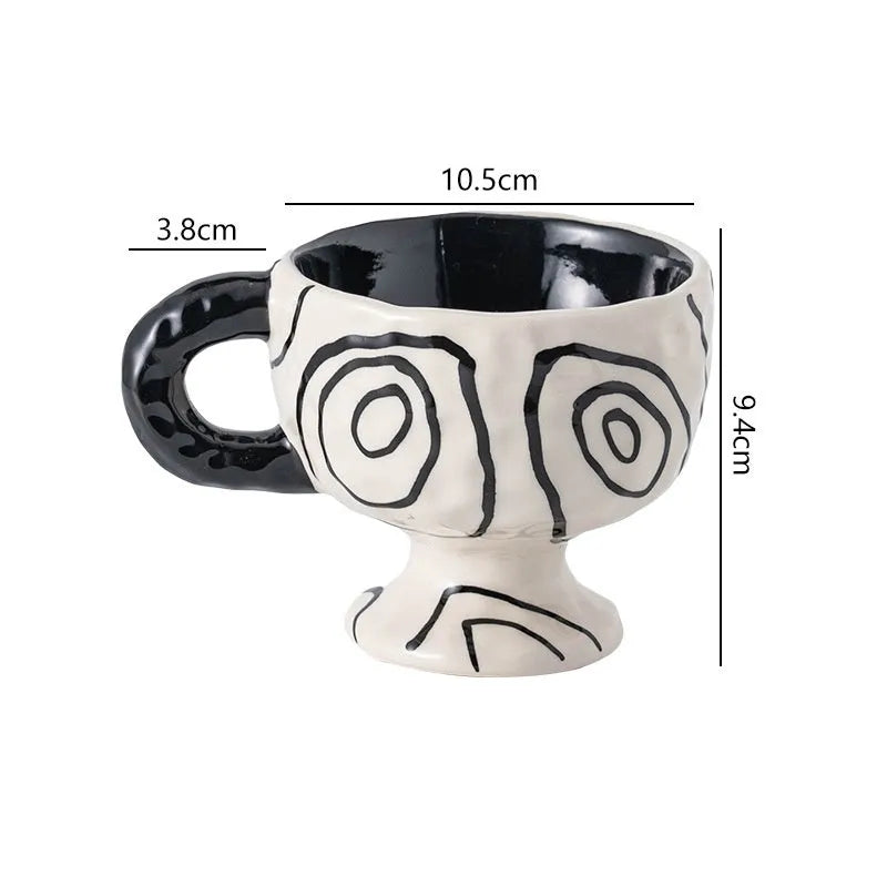 Hand-pinched irregular ceramic mug in solid colour with modern simple design