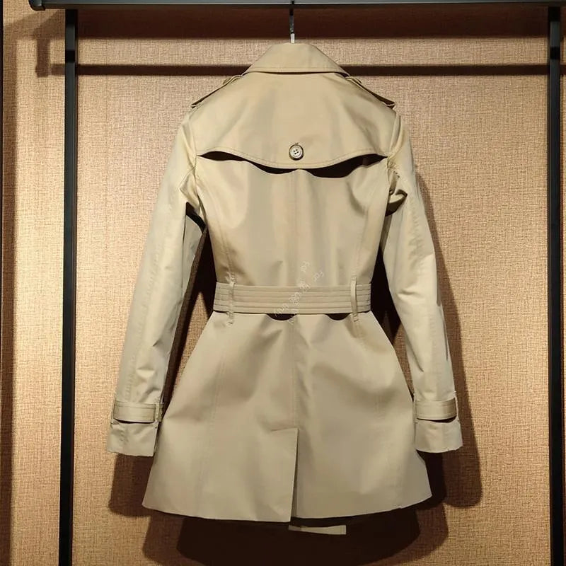 Khaki women's double-breasted trench coat with long flight sleeves, button front.
