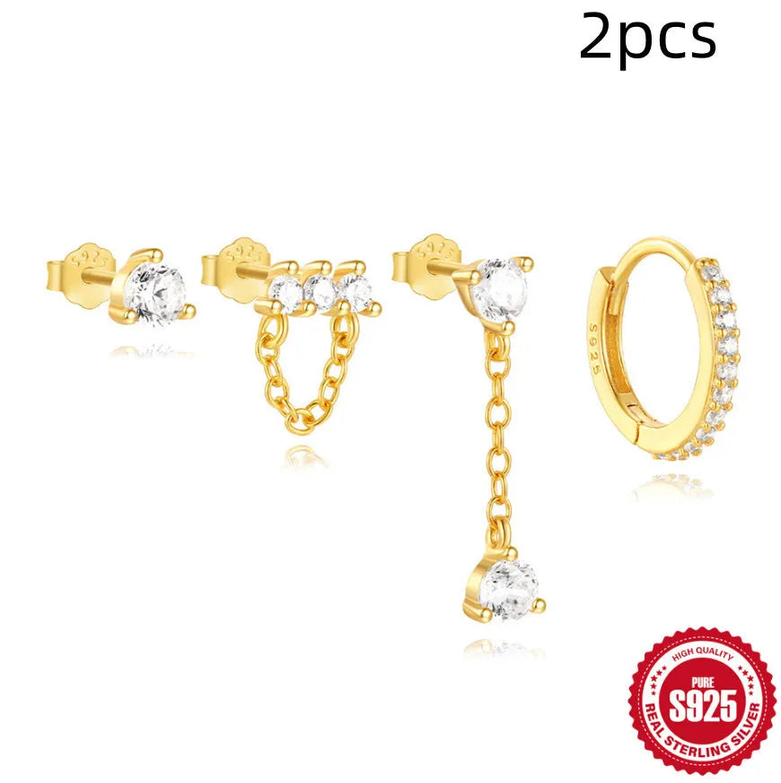 A pair of geometric clover petal earrings made of S925 sterling silver with a gold electroplated finish.