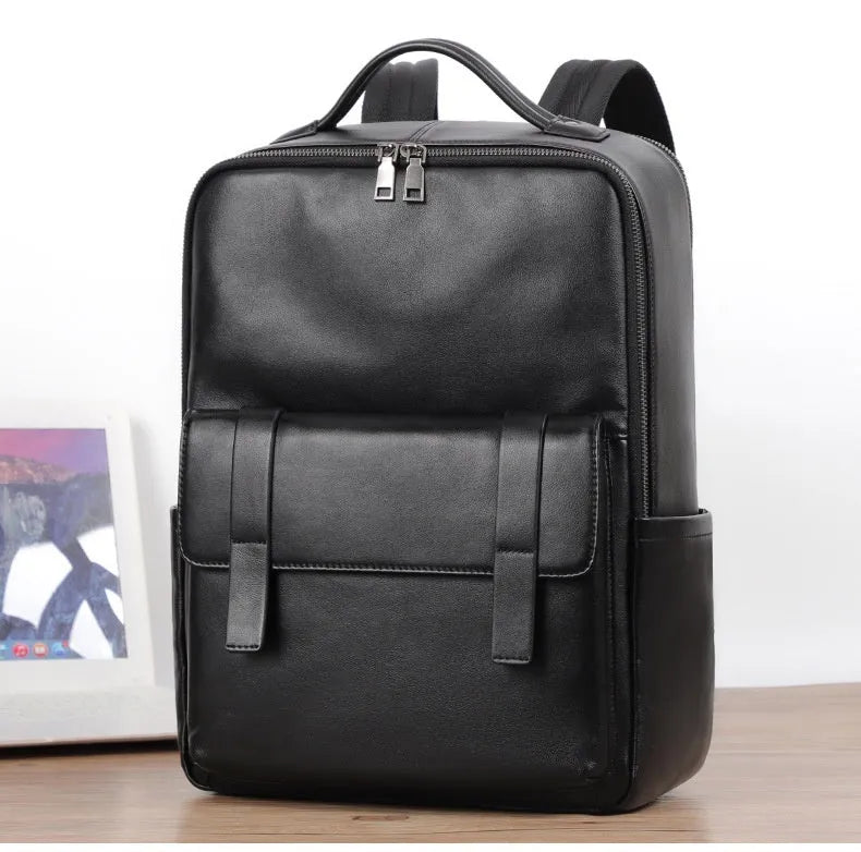 Black genuine leather men's business laptop backpack with 36-55L capacity showing weaving design details