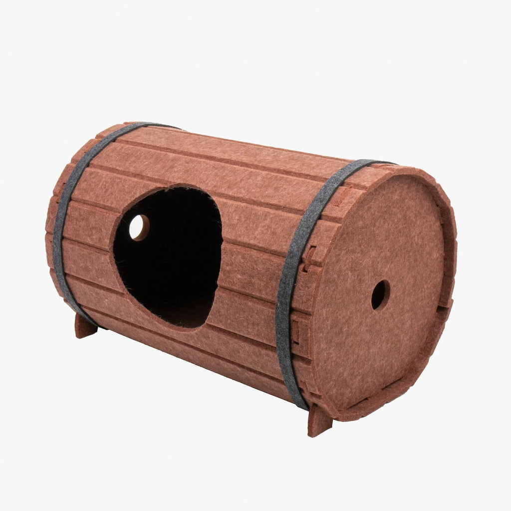 DIY wine barrel shaped cat bed made from three brown felt panels with binding straps