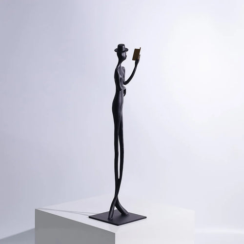Black metal cast aluminium desktop sculpture with modern minimalist character figure design