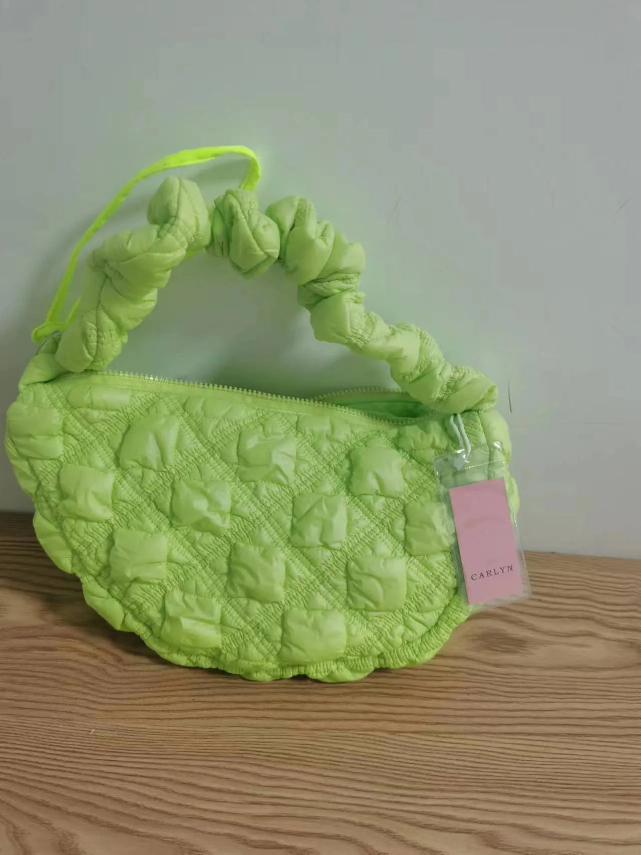 Women's nylon shoulder messenger bag in beige colour showing adjustable strap and dimensions