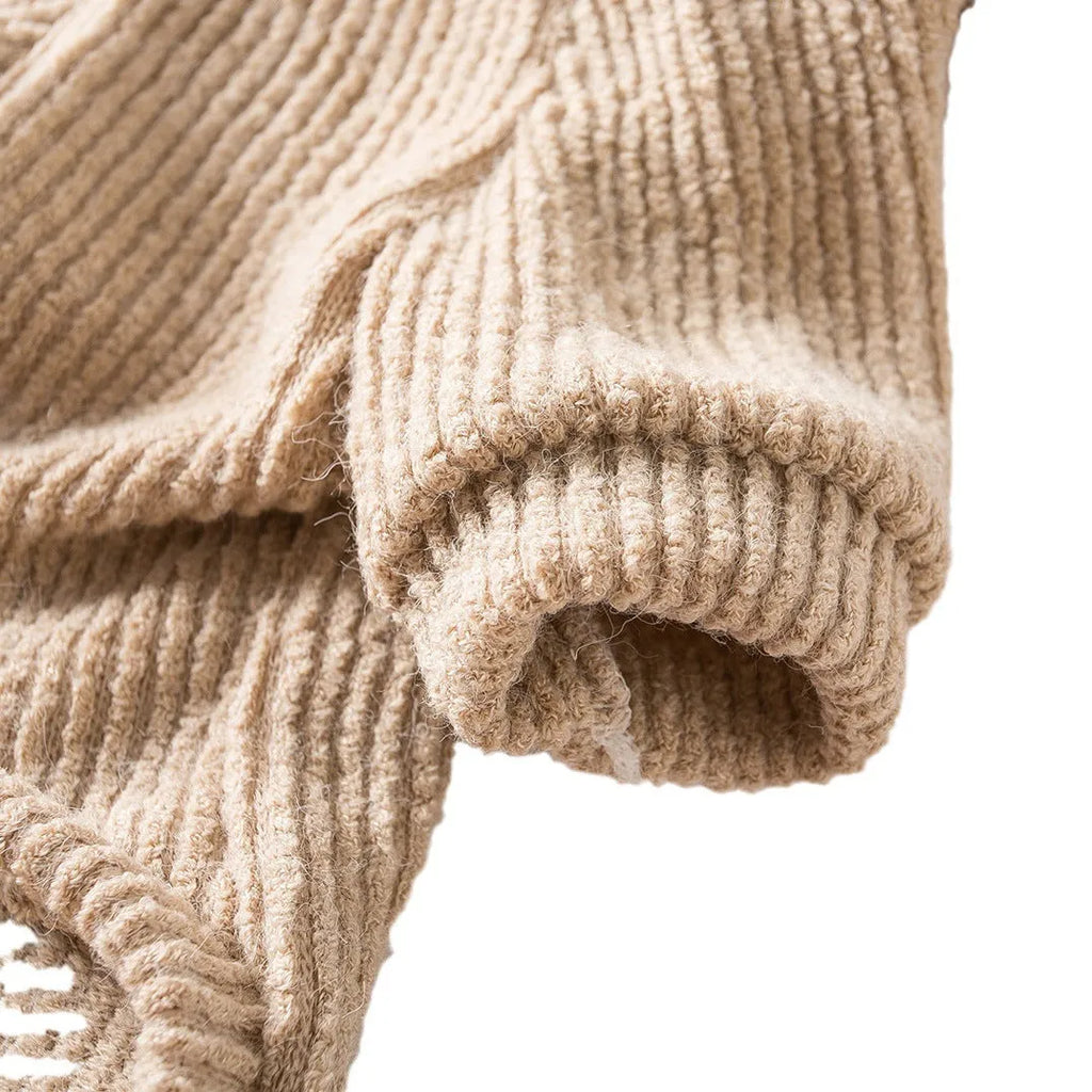 Brown cloth pullover dog sweater on a small breed dog.