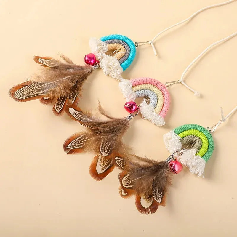 Colourful feather cat rope toy hanging from a door with elastic swing and sticky buckle clamp