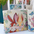 Double-sided gold wire embroidered canvas tote bag in small, medium, and large sizes with floral patterns.