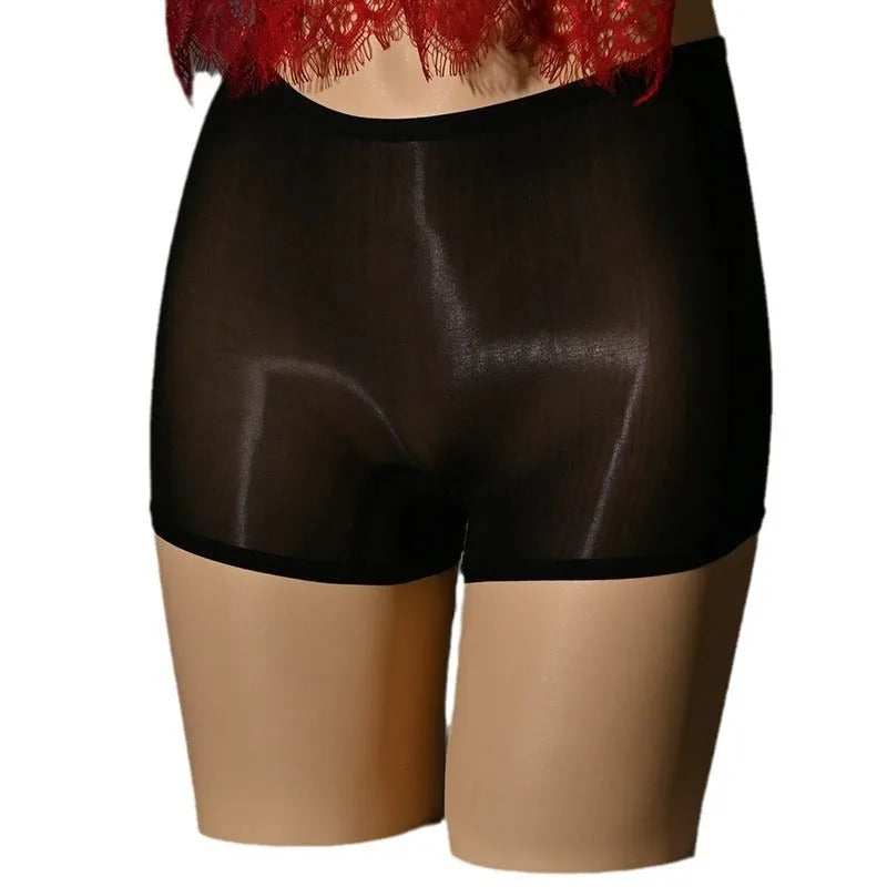Shiny black nylon men's seamless underwear stockings laid flat, showing mid-waist cut.