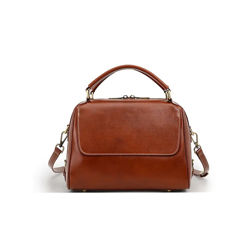 Women's soft genuine leather crossbody tote bag in a square shape with a double strap, shown in apricot colour.