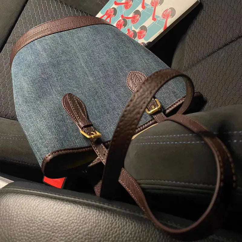 Blue denim patchwork one-shoulder bucket handbag showing retro style and large capacity.