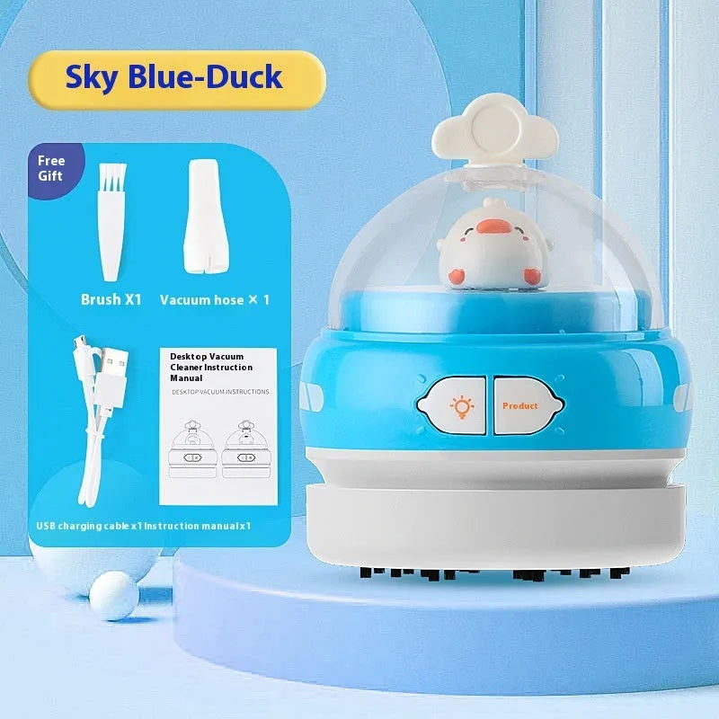 USB handheld desktop vacuum cleaner in blue rocket design on a wooden desk