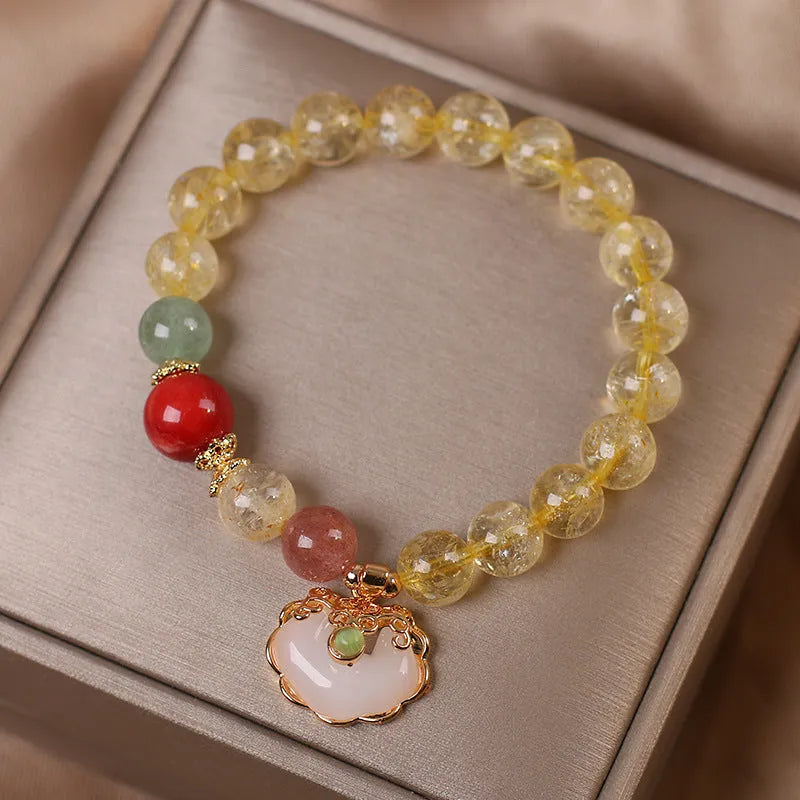 Original design women's alloy bracelet with a natural yellow hair crystal citrine jade ruyi pendant charm.