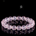 Natural pink starlight crystal round bead bracelet with polished finish in various sizes from 6mm to 22mm