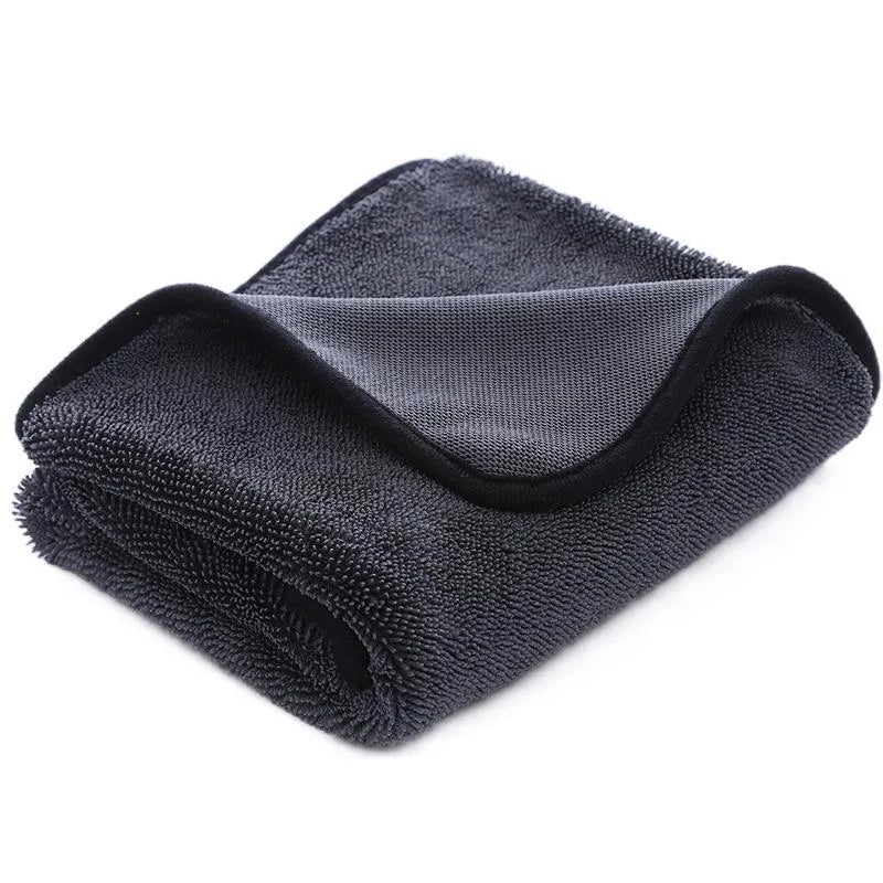 Grey car cleaning towel with red edge trim showing braid twisted texture for automotive glass washing