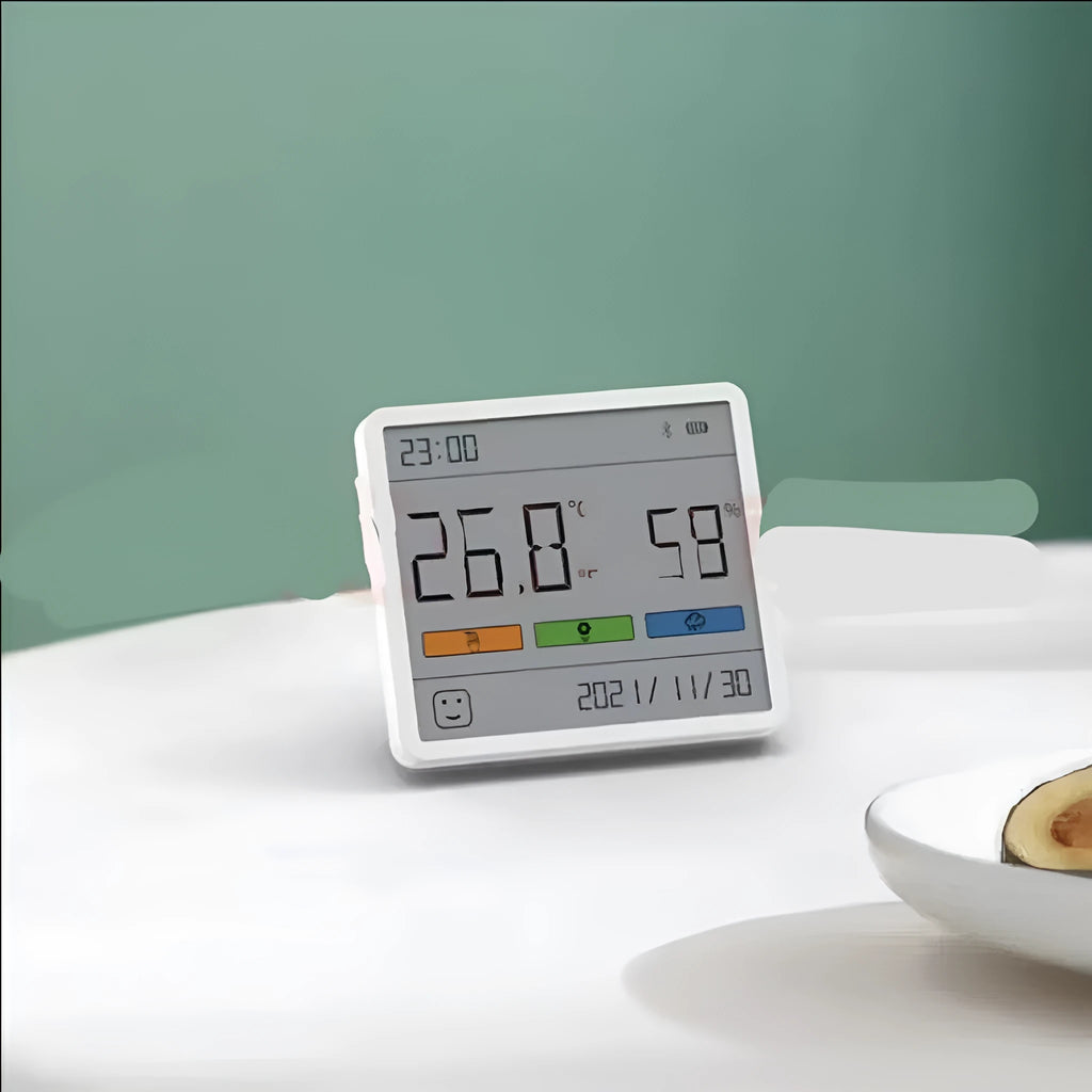 Mini digital clock hygrometer with ABS body and PMMA screen, showing temperature and humidity on a white background