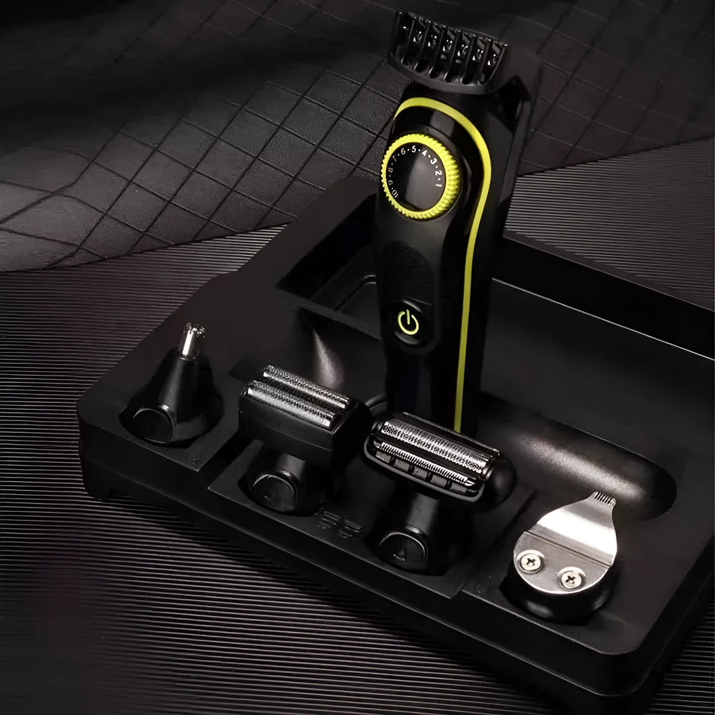 Black KM-696 rechargeable electric hair clipper set with stainless steel blades and accessories on a white background.
