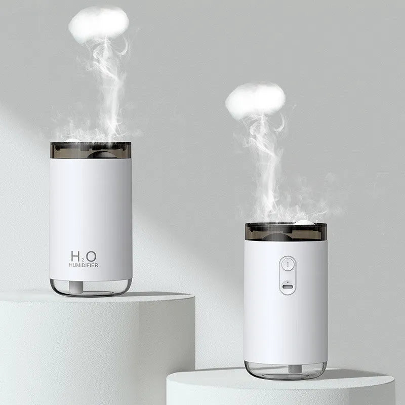 Blue jellyfish humidifier on a table emitting smoke ring mist with warm night light glow