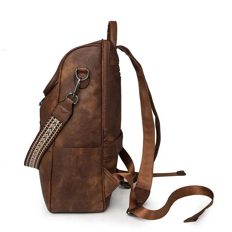 Retro college backpack in black PU leather with curved shoulder straps and stitching details