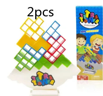 Plastic balance stacking game with 16 coloured building blocks, chassis, and base on a table