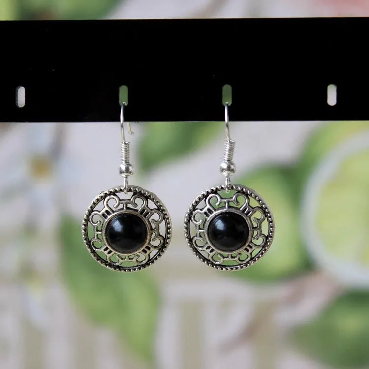 Geometric turquoise flower disk earrings in Miao silver with ethnic patterns