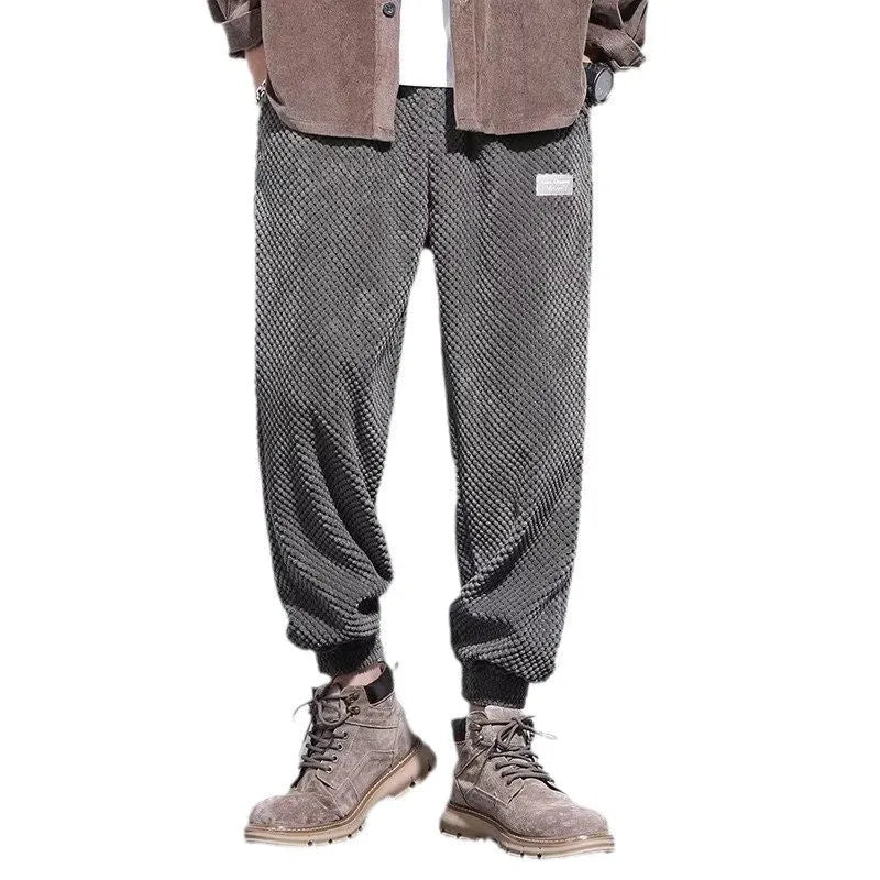 Grey men's straight leg sweatpants with an ankle strap tie detail