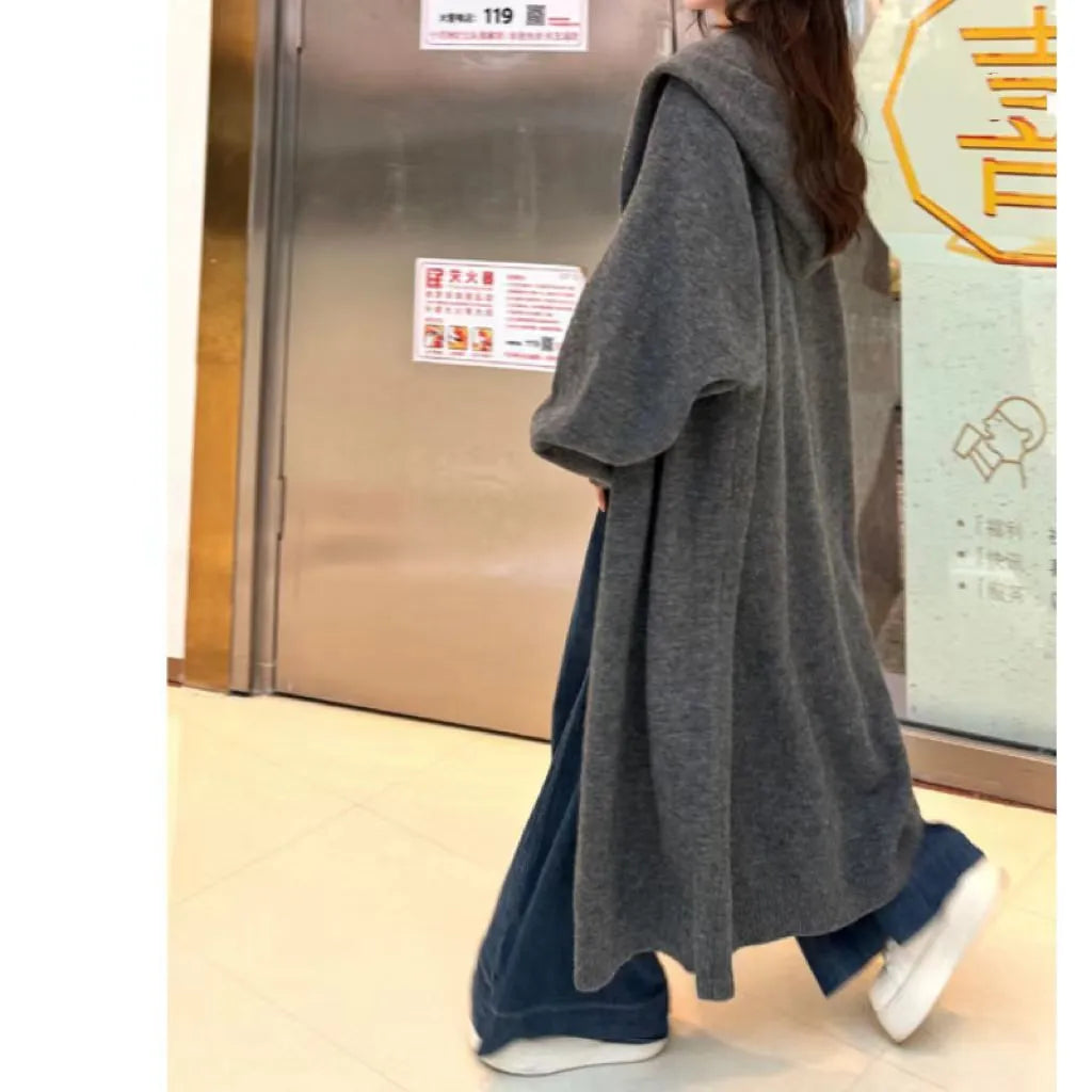 Korean style long hooded knitted cardigan coat for women in a loose free size.